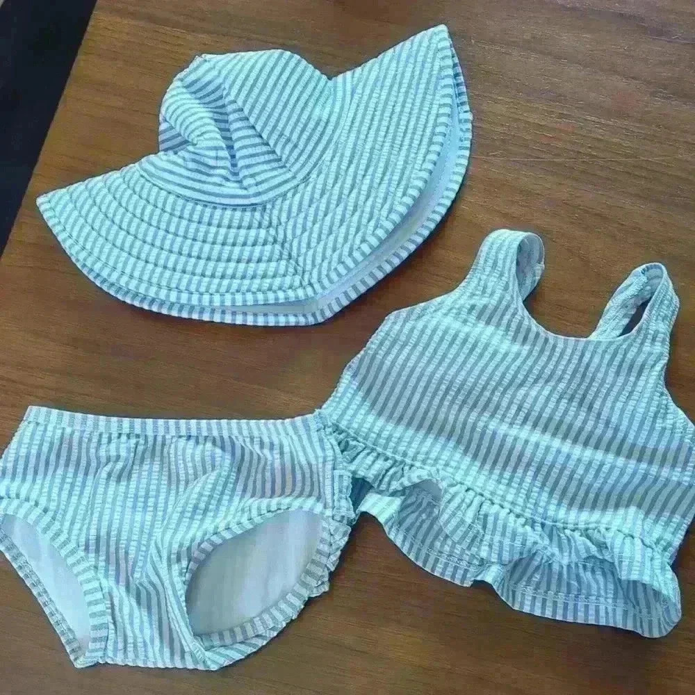 Ruffle but 0 to 12 swim set, light blue and white seersucker.